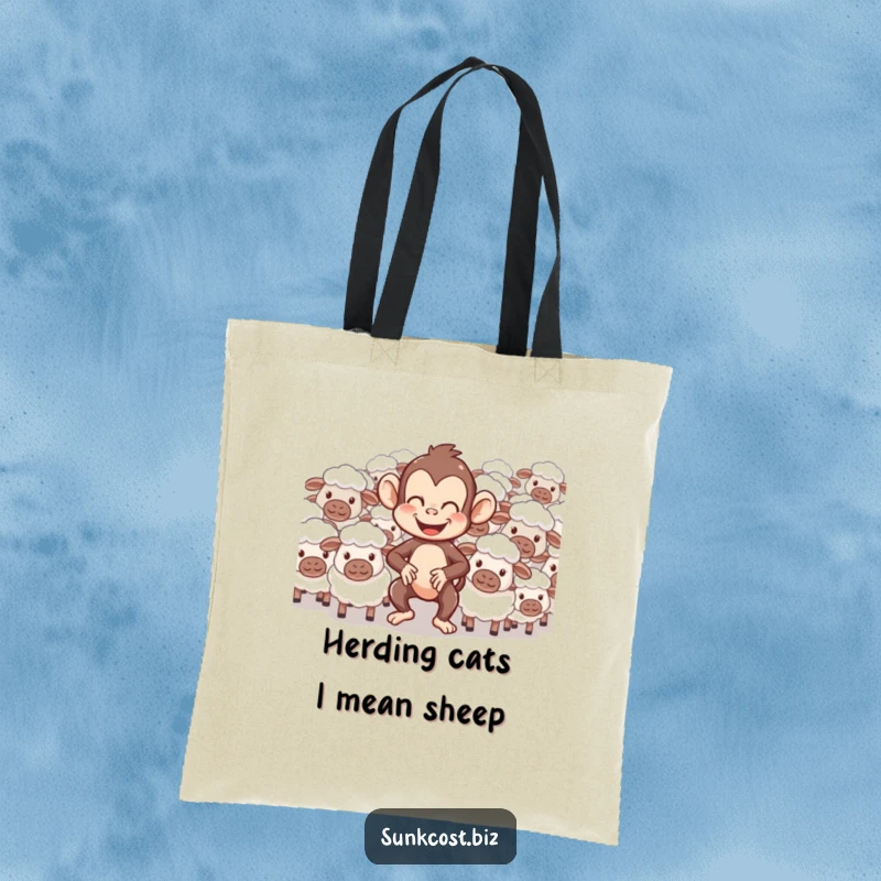 Funny tote bag depicting a giggling monkey comically herding a flock of confused sheep, ideal for stylish and humorous shoppers.